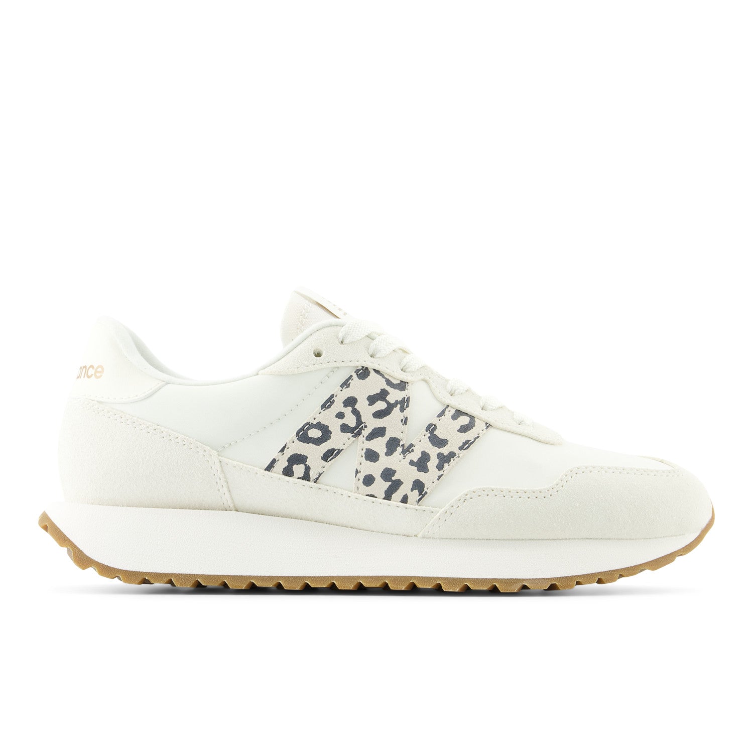 White sneaker with leopard print accents on a white background