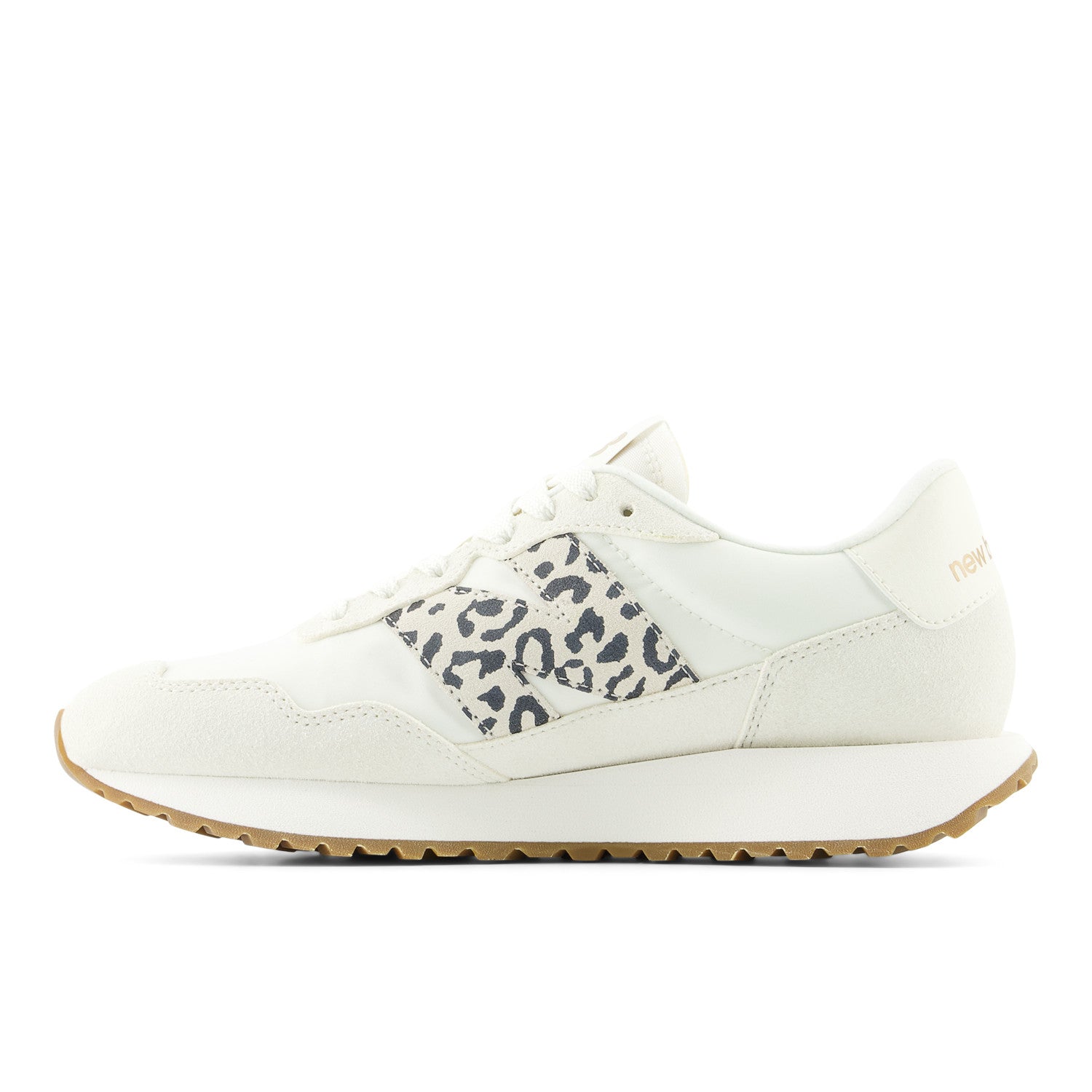 White sneaker with leopard print accents on a white background