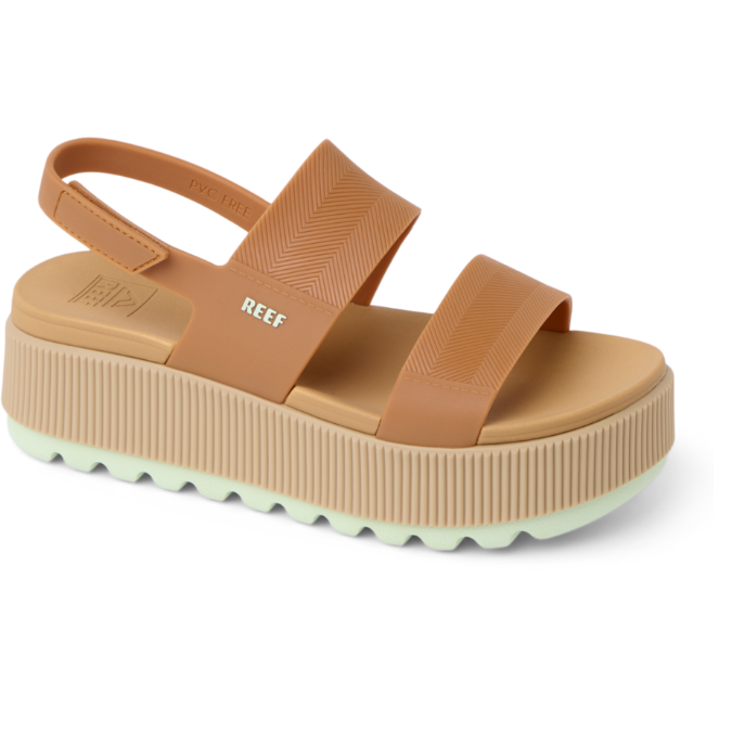 Tan platform sandal with 'REEF' branding on a white background