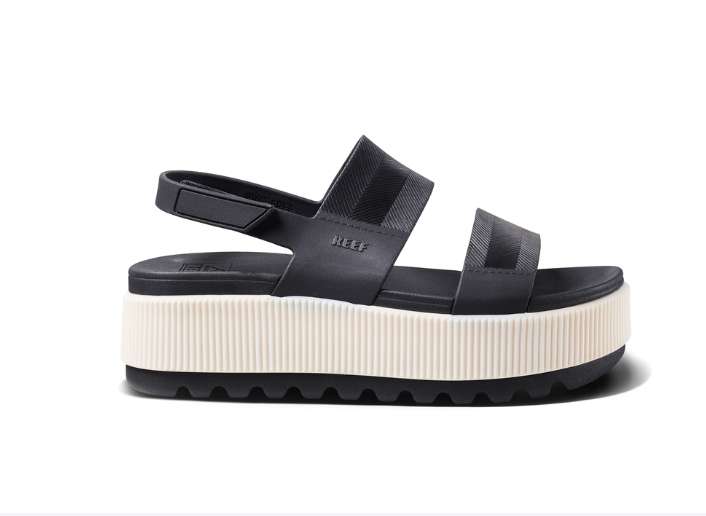 Black platform sandal with white sole on a white background