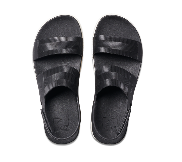 Black slide sandals on a white background