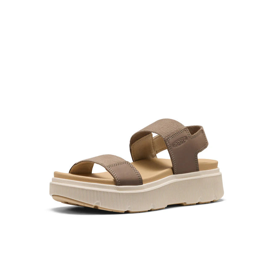 Beige sandal with a platform sole on a white background