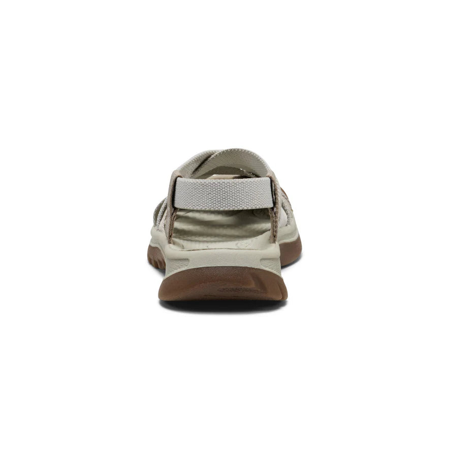 Beige sandal with brown sole on a white background