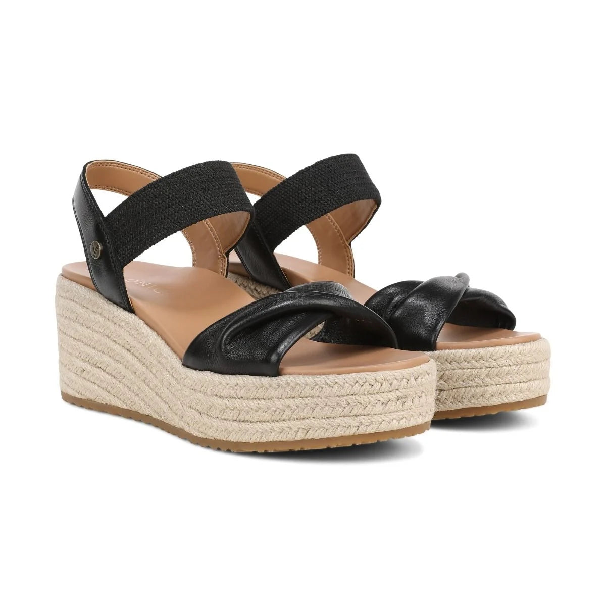 Black wedge sandals with espadrille sole on a white background