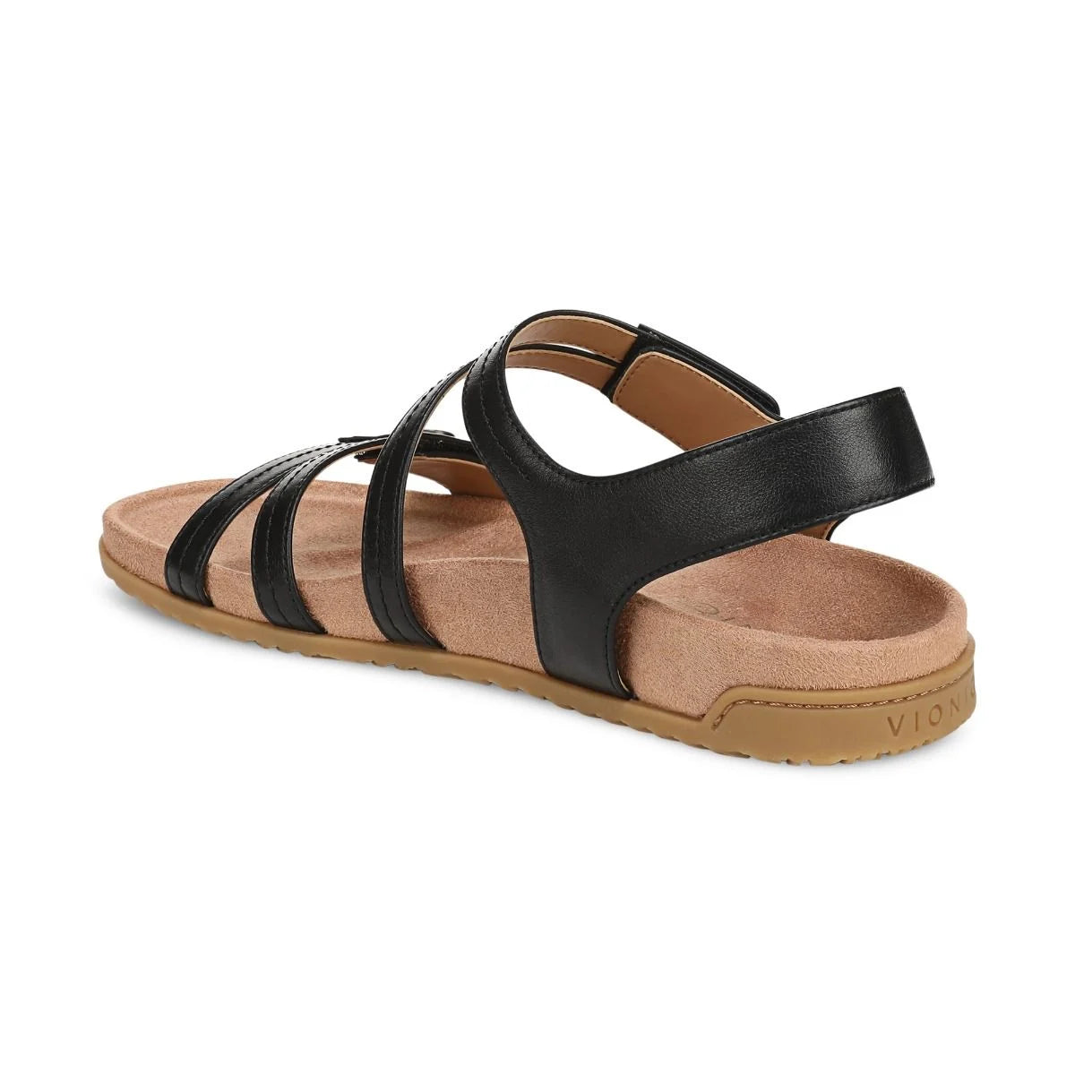 Black sandal with tan sole on a white background