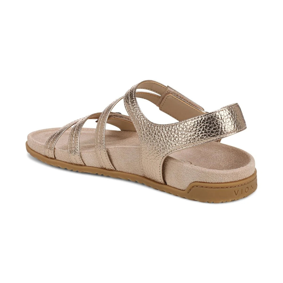 Gold sandal with multiple straps on a white background