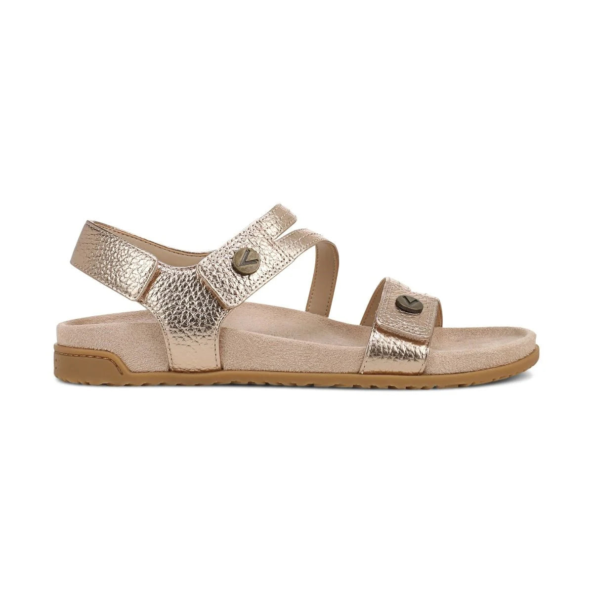 Gold sandal with multiple straps on a white background