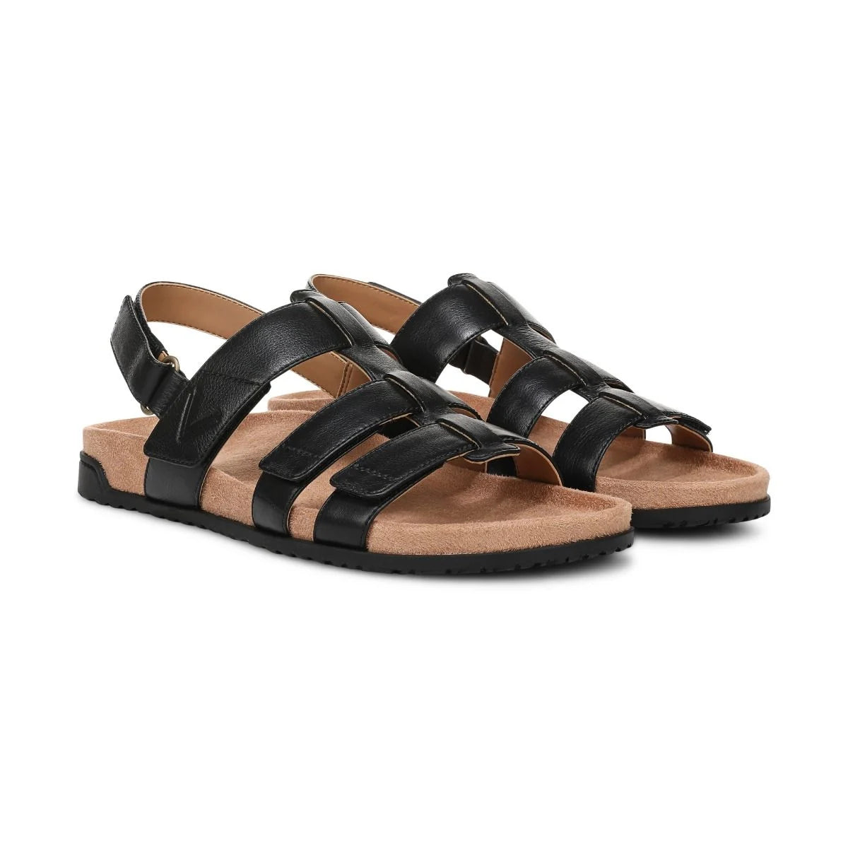 Black strappy sandals with cork sole on a white background