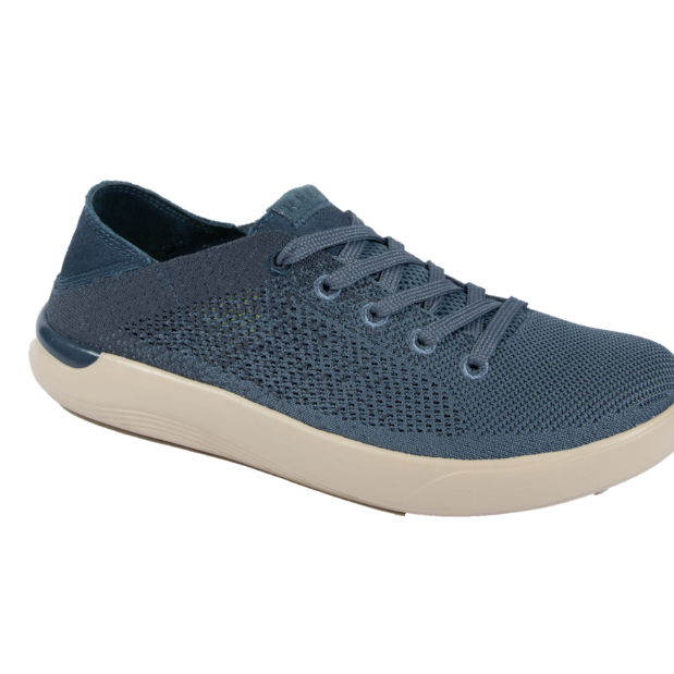 Blue sneaker with a white sole on a white background