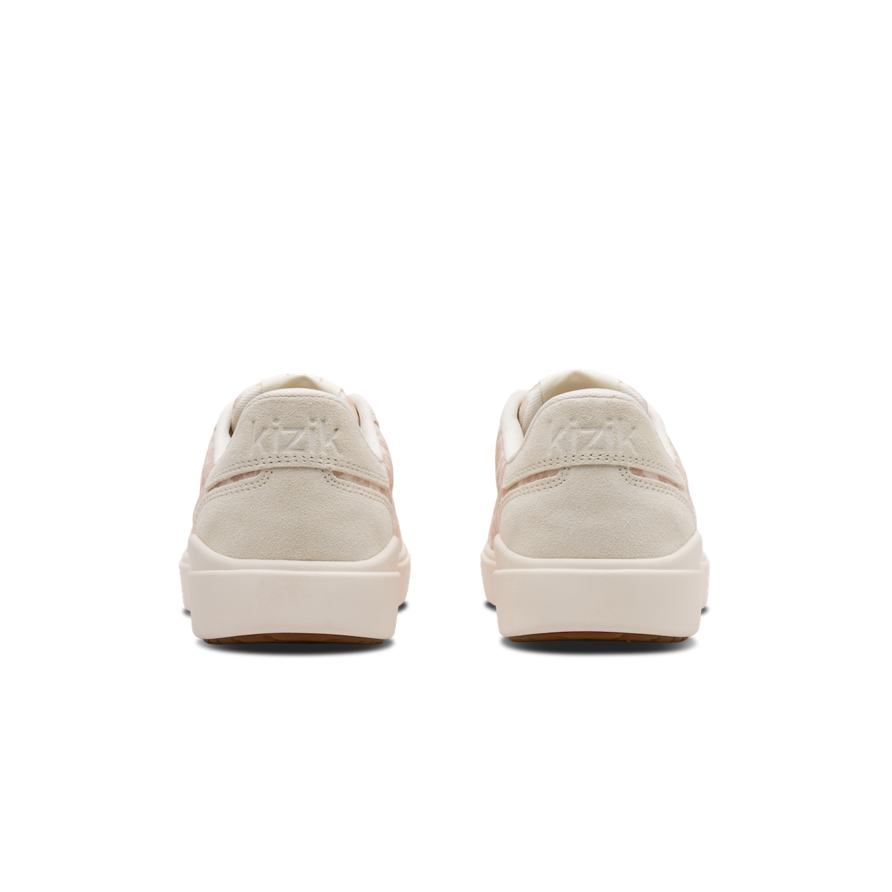 Pair of beige sneakers on a white background