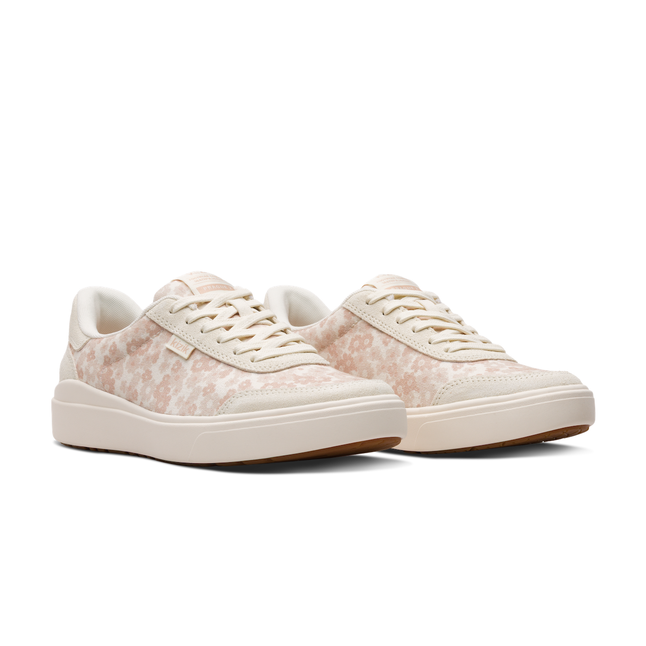 Pair of white sneakers with a subtle pattern on a white background
