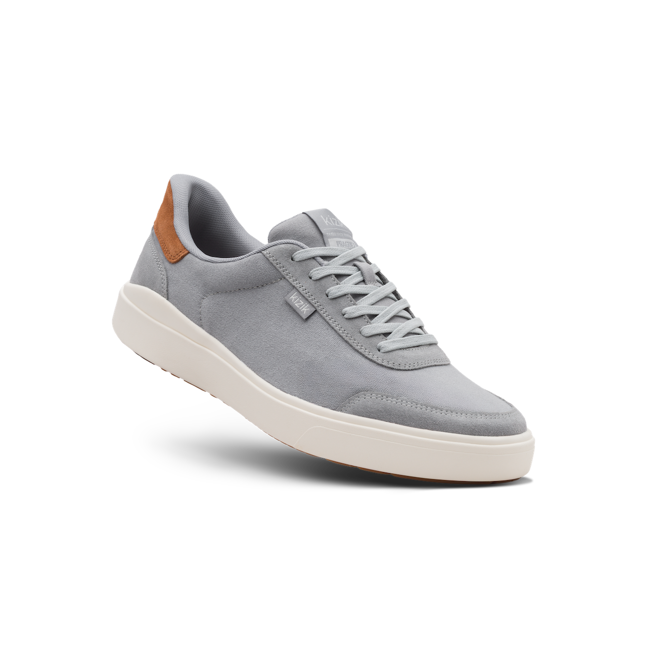 Gray sneaker with a brown accent on a white background