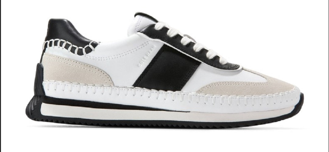 White and black sneaker with beige accents on a white background