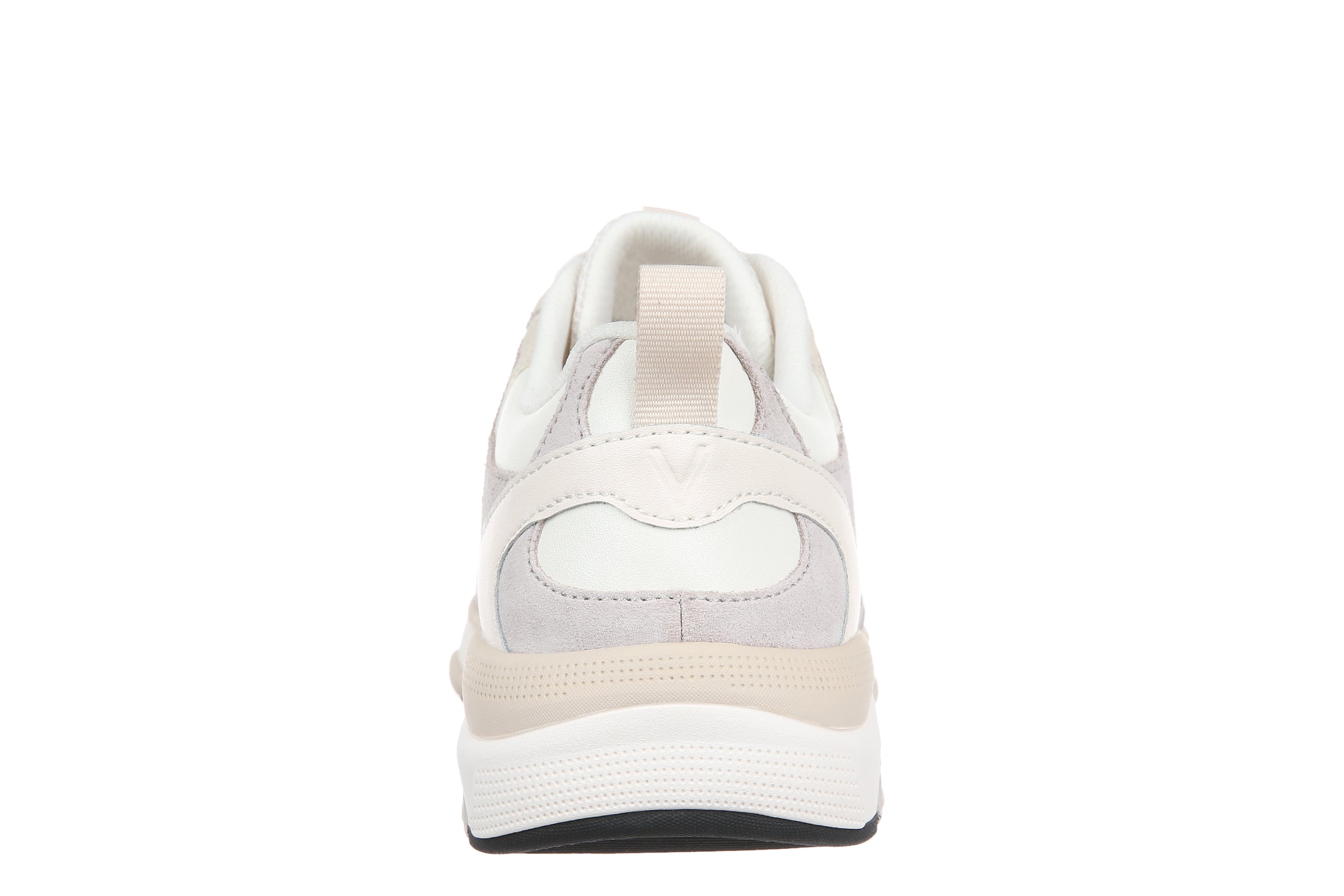 A white and light gray sneaker shown from the back, featuring a thick white midsole with a beige accent layer and a black outsole.