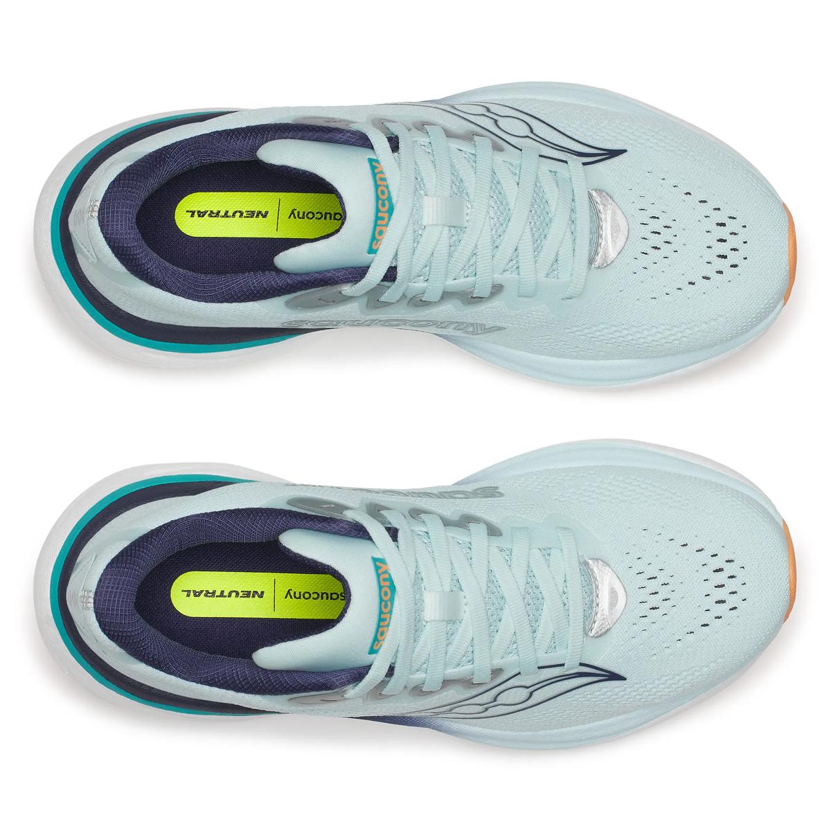 Light blue running shoes with white soles on a white background