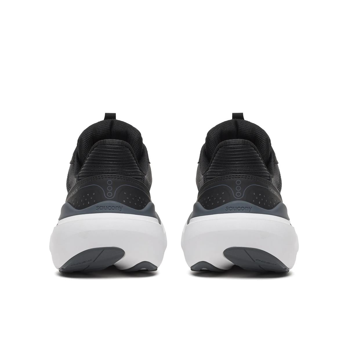 A pair of black and dark gray athletic sneakers shown from the back, featuring chunky white midsoles and dark gray outsoles, set against a plain white background.