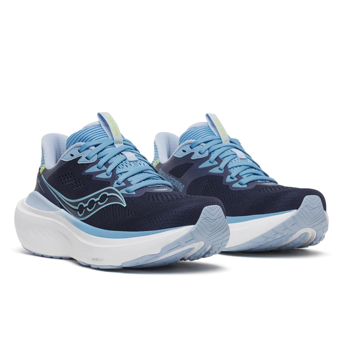 A pair of Saucony running shoes in navy blue, light blue, and white, shown from a three-quarters angle on a white background.