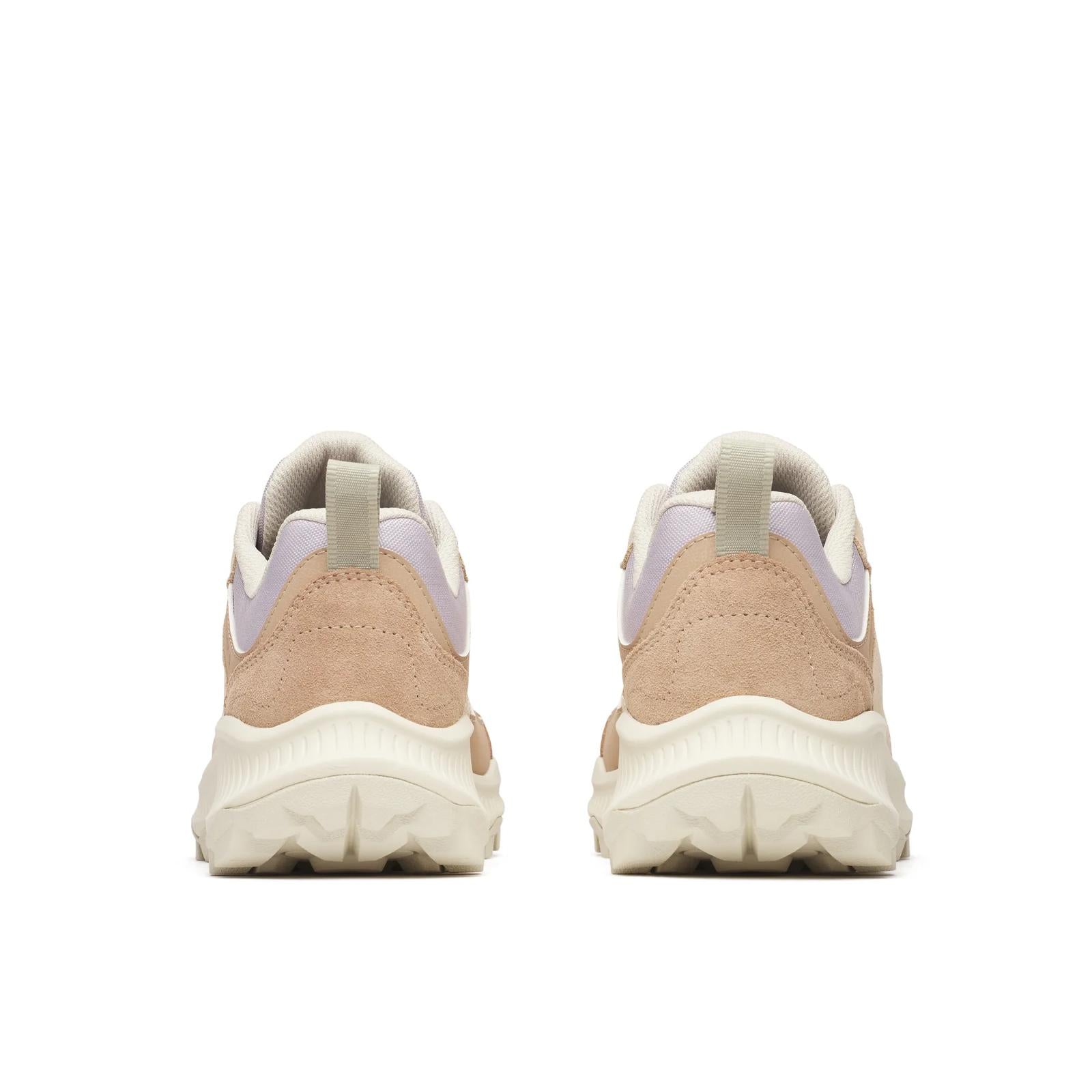Pair of beige sneakers with white soles on a white background