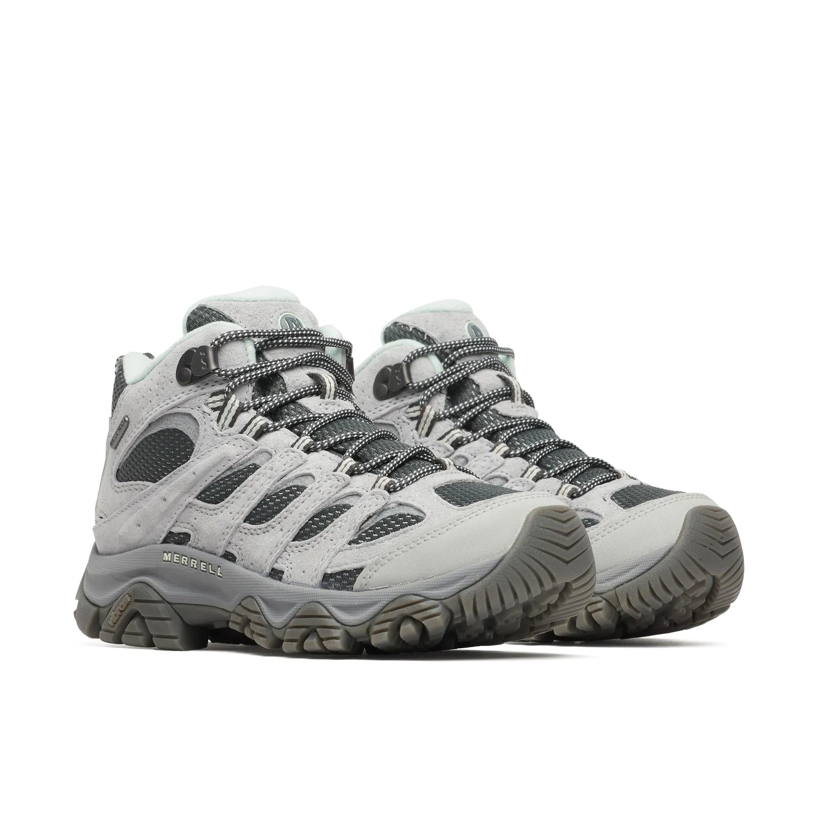 Pair of gray hiking boots with visible brand name on a white background