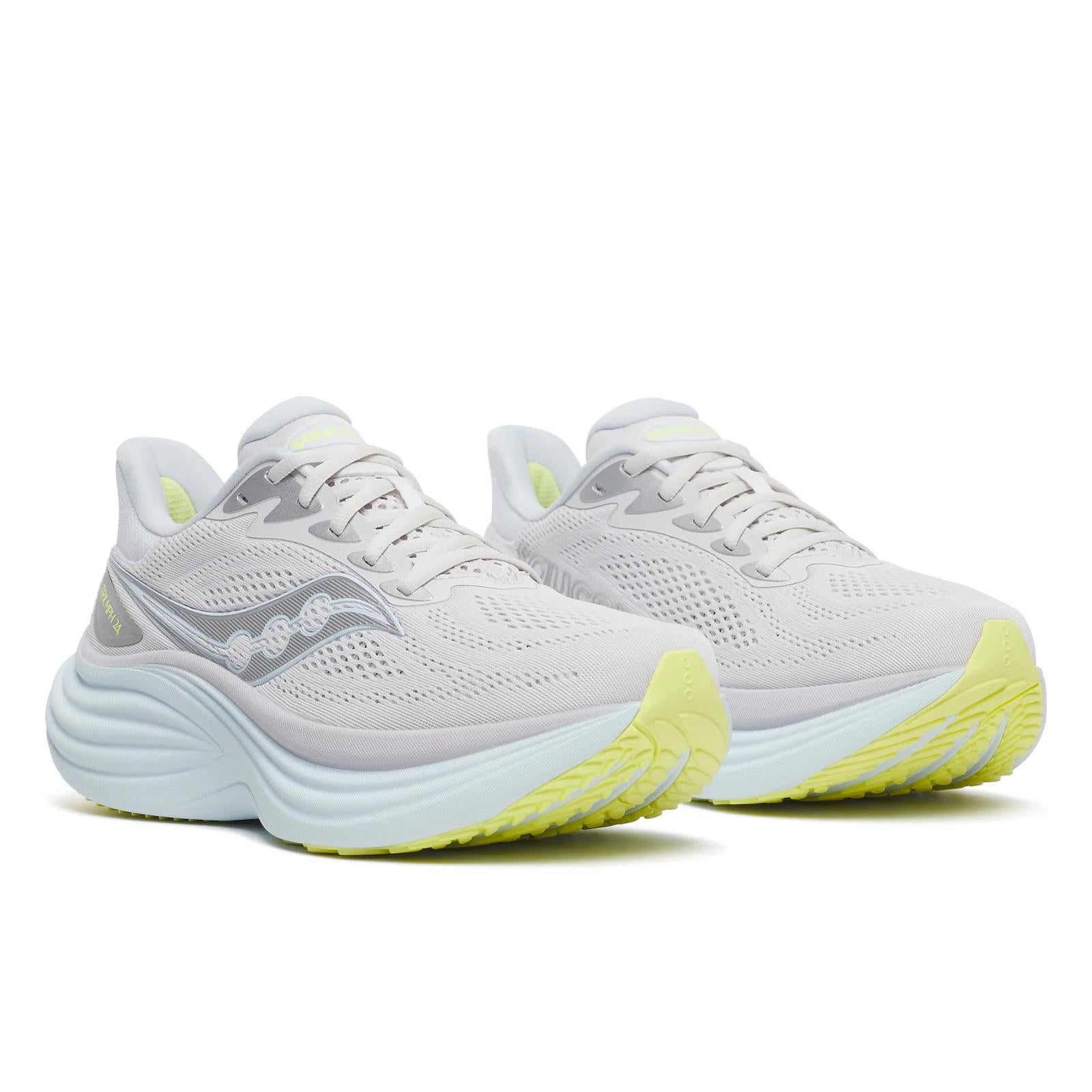White running shoes with yellow soles on a white background