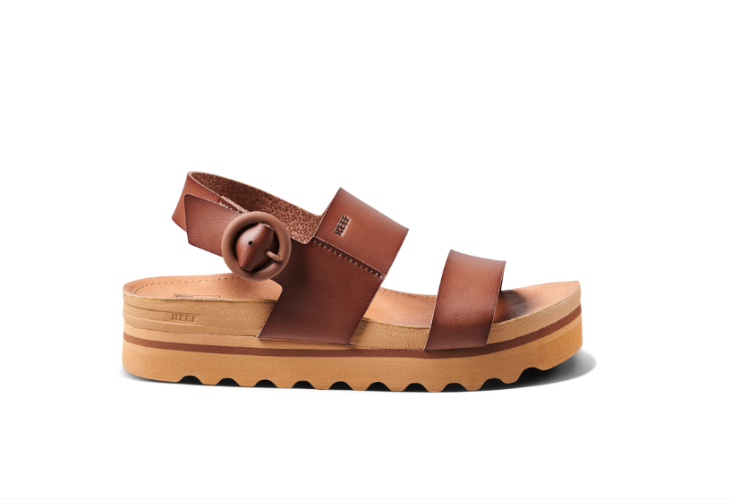 Brown sandal with wooden sole on a white background