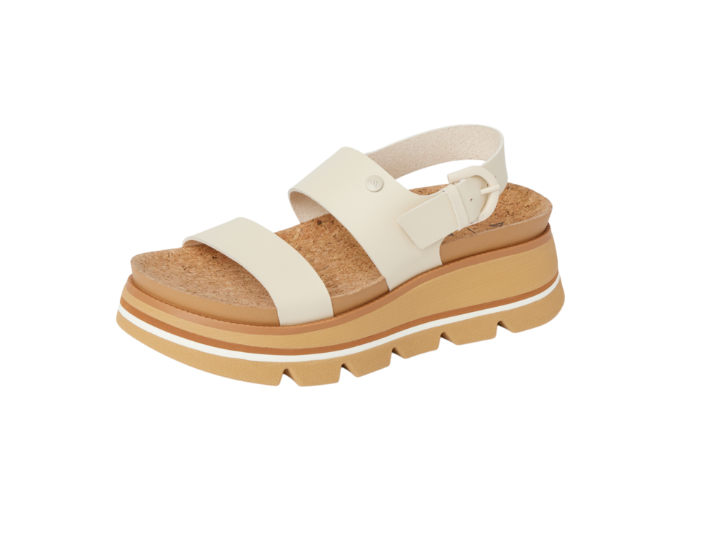 White sandal with a brown sole on a white background