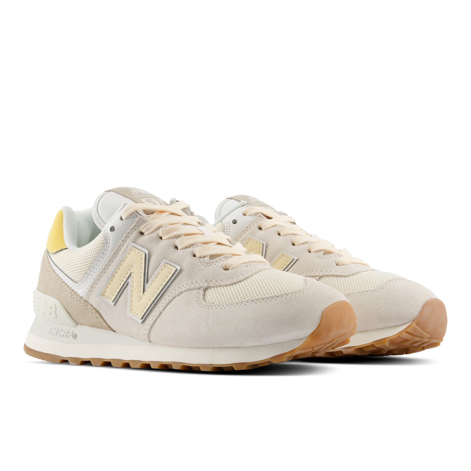 Beige sneakers with brown soles on a white background