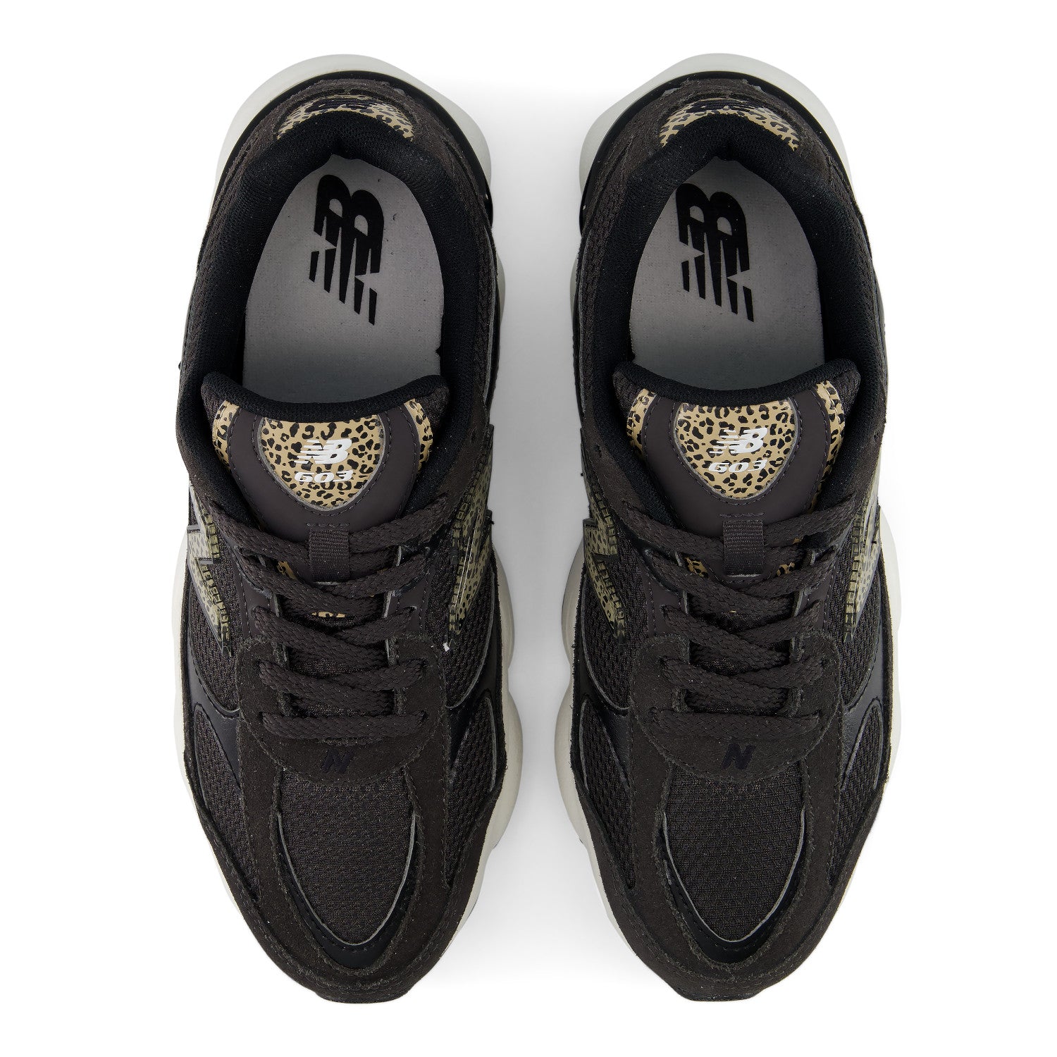 A pair of black New Balance sneakers shown from a top-down view, featuring leopard print accents on the tongue and heel collar, black laces, and a white midsole.