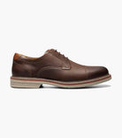 Black leather golf shoe with a white background