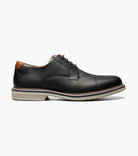 Black leather dress shoe on a white background