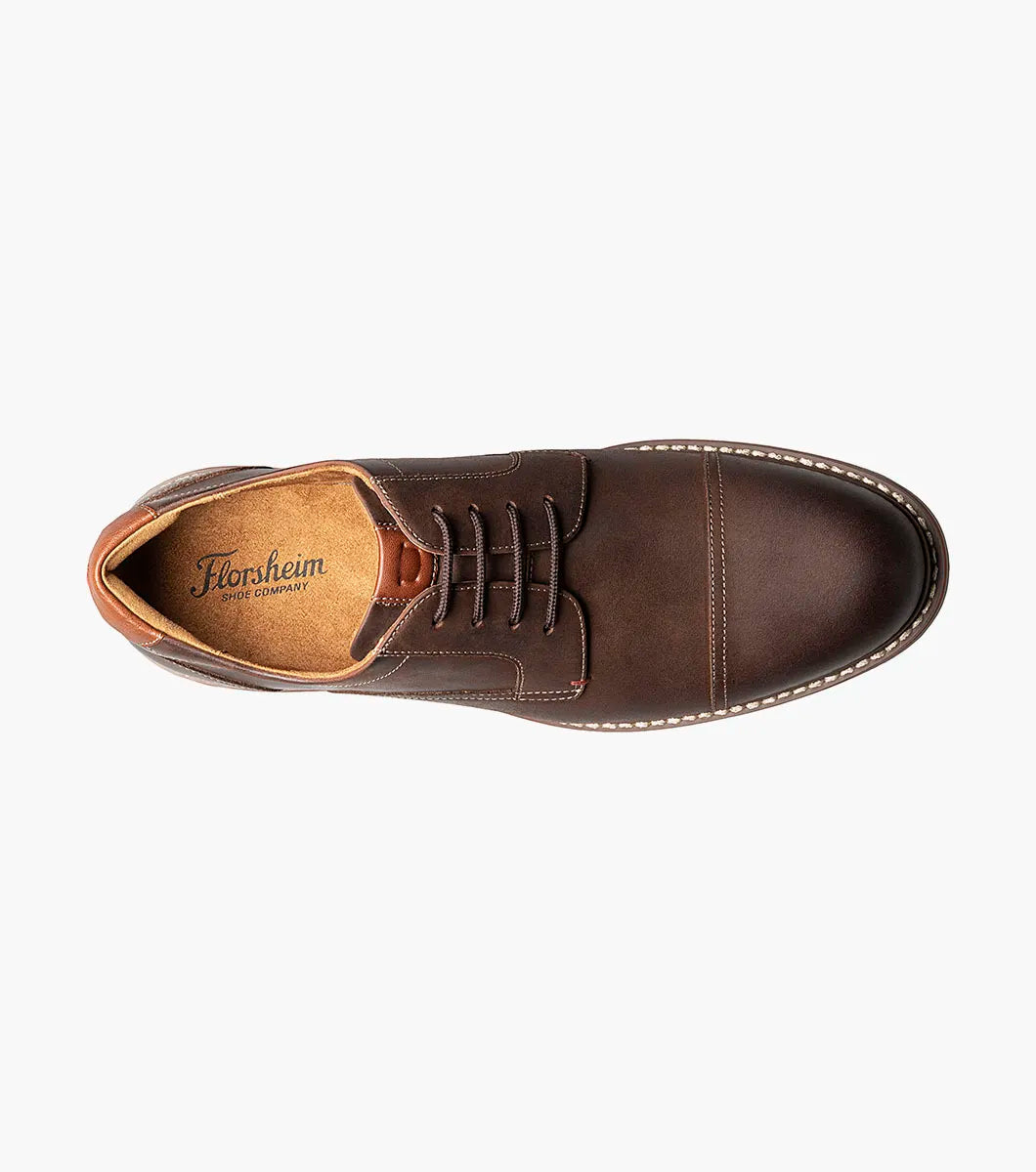 Brown leather shoe with 'Florsheim' branding on a white background