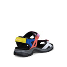 Multicolored sandal with a yellow strap on a white background