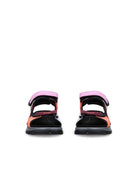 Black and pink sandals on a white background