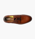 Brown leather dress shoe with Florsheim logo on a white background