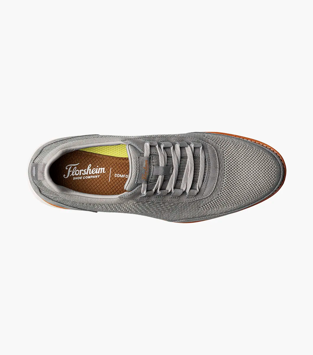 Gray sneaker with visible Florsheim logo on a white background