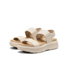 Beige sandals with platform sole on a white background