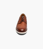 Brown leather shoe on a white background