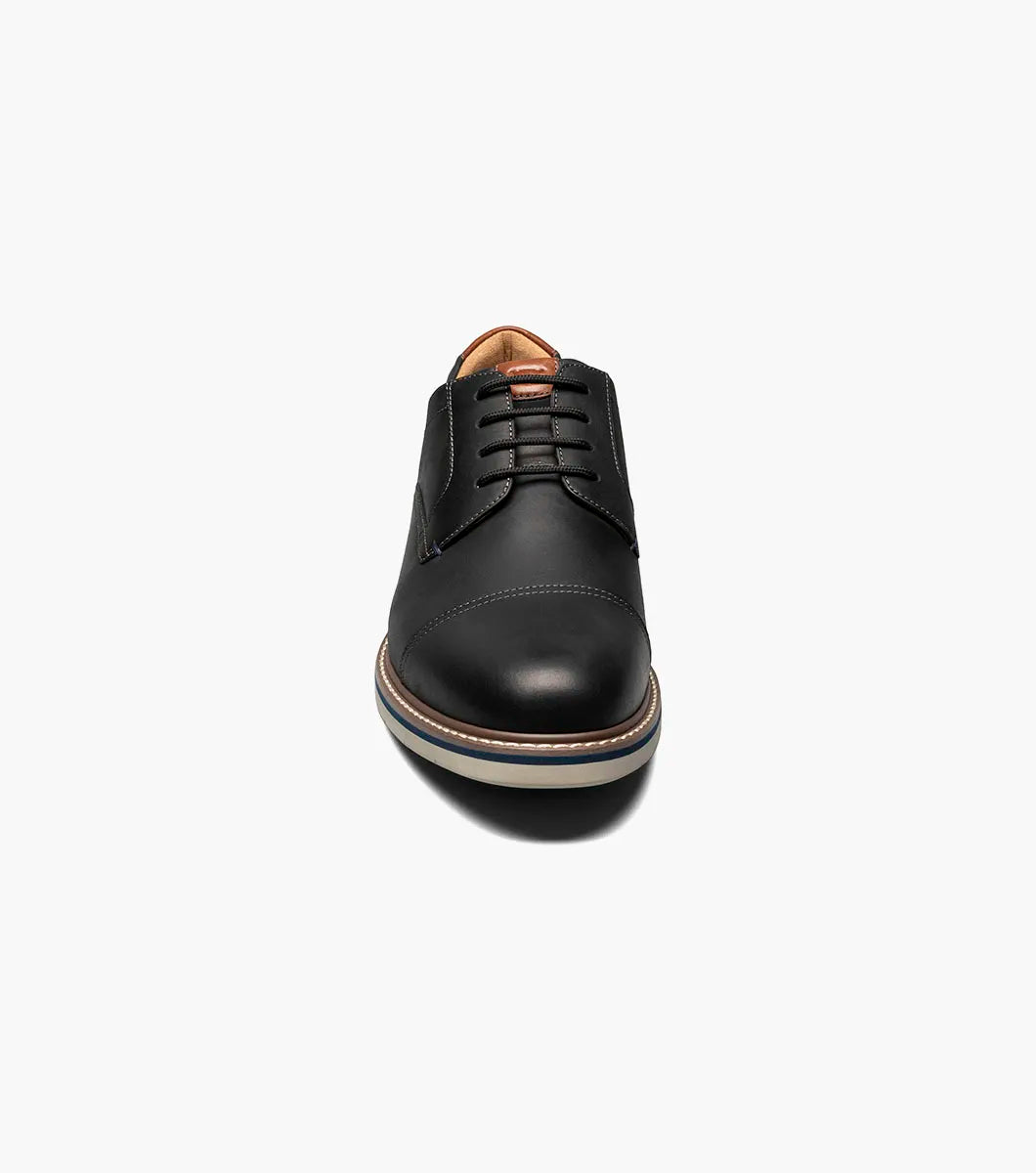 Black leather shoe on a white background