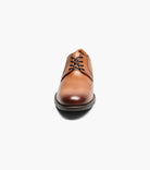 Brown leather dress shoe on a white background