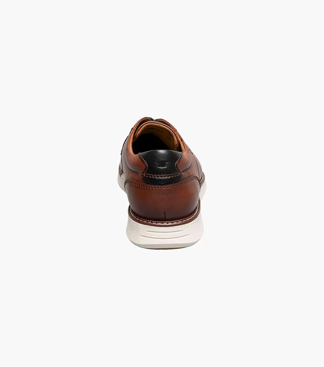 Brown leather shoe on a white background