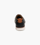 Black leather shoe with brown lining on a white background