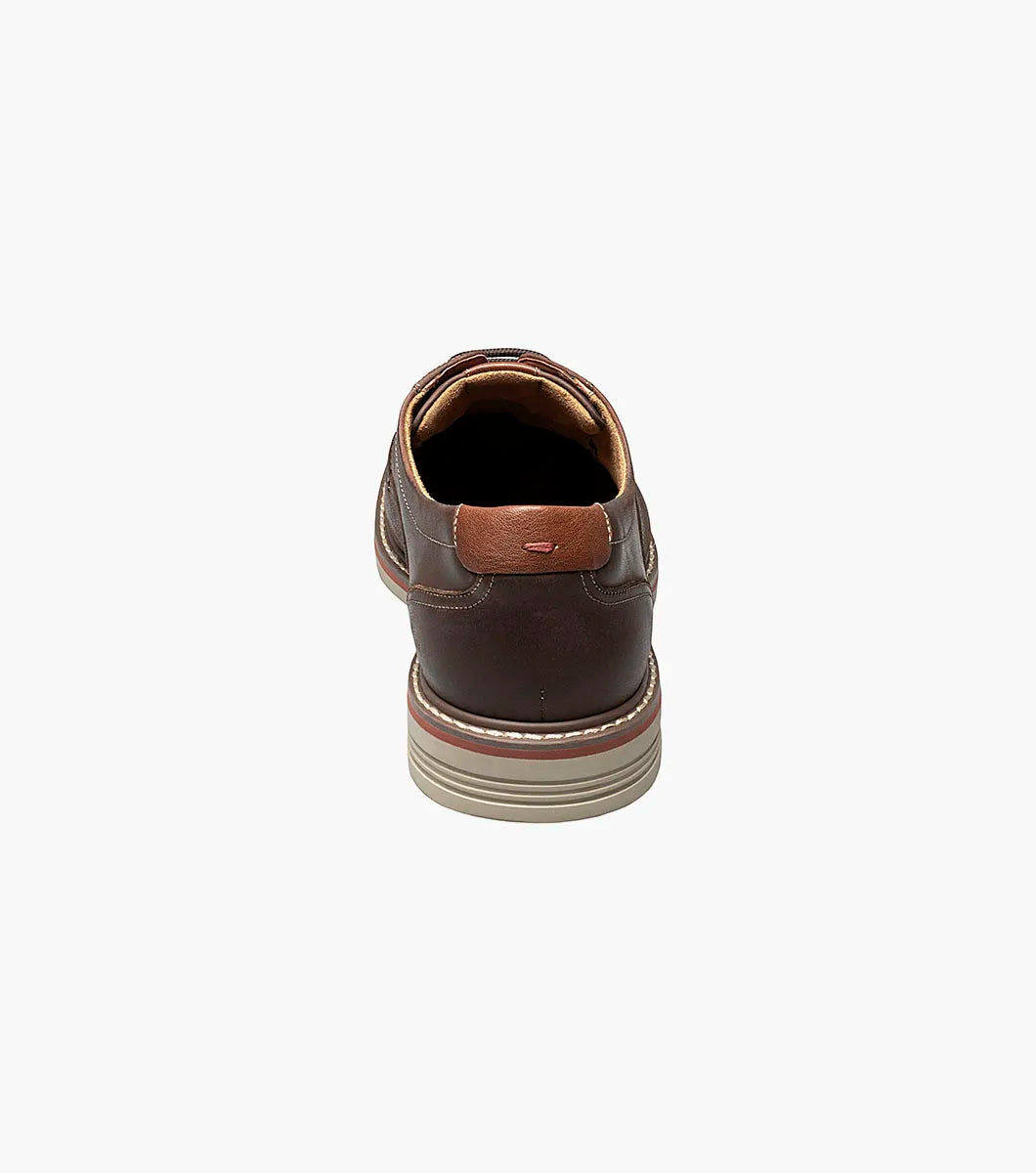 Brown leather shoe on a white background
