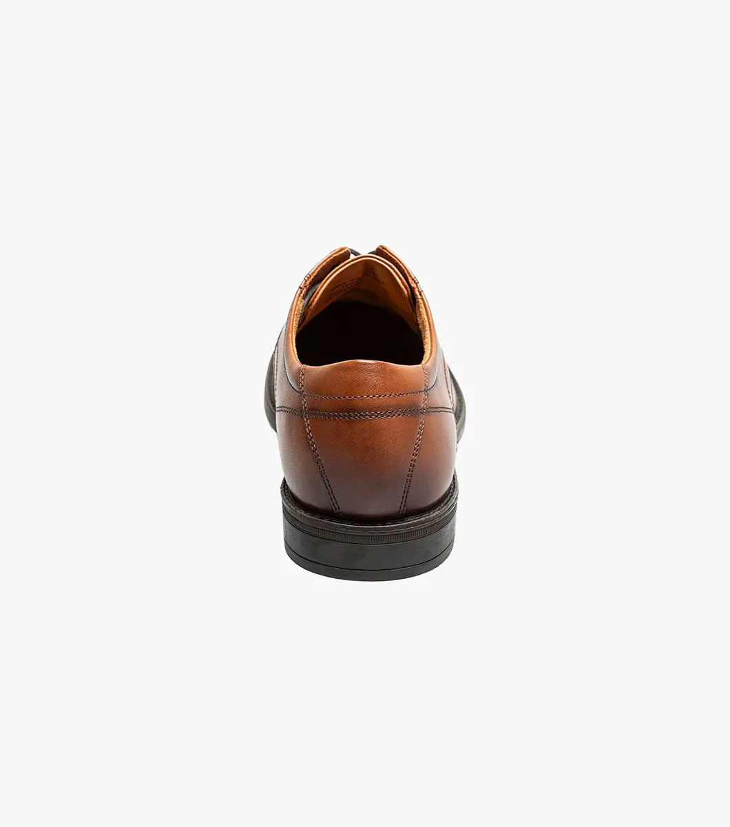 Brown leather shoe on a white background