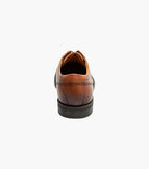 Brown leather shoe on a white background