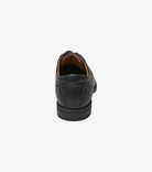 Black leather dress shoe on a white background