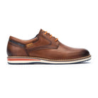 Brown leather shoe with orange laces on a white background