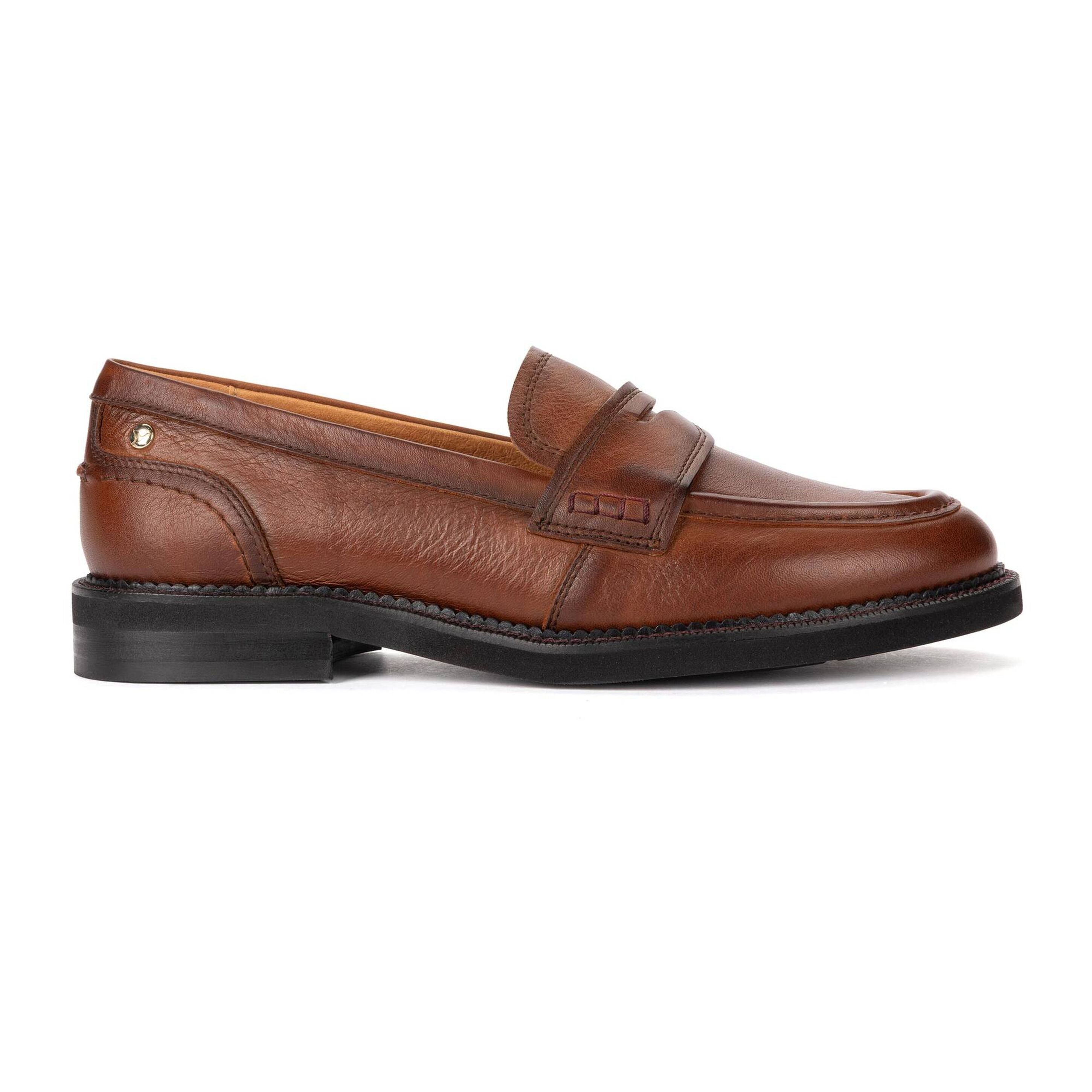 A brown leather penny loafer shown in a side profile view against a plain white background.