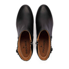 A pair of black leather ankle boots shown from a top-down view on a white background, featuring side zippers and a tan interior with the brand name 'PIKOLINOS' printed on the insole.