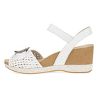 White wedge sandal with cork sole on a white background