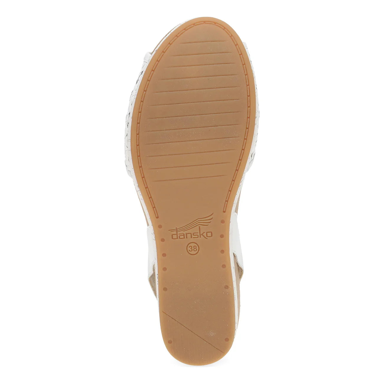 Tan sole of a shoe with 'dansko' branding on a white background